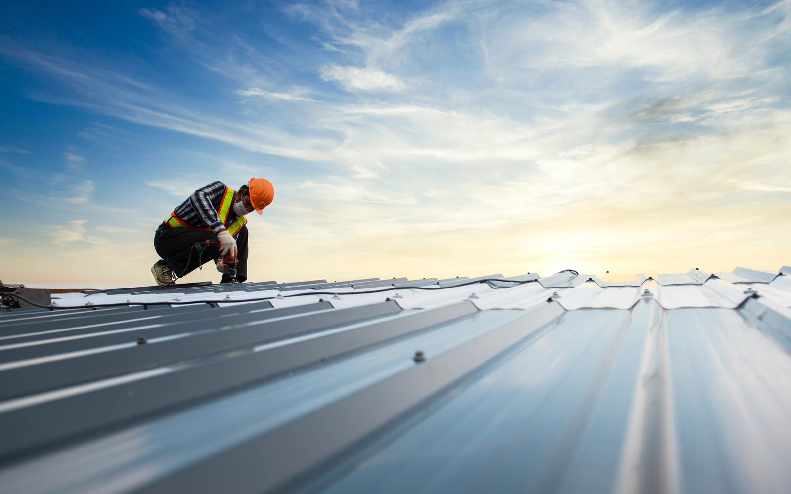 Builders,In,Work,Clothes,Install,New,Roofing,Tools,,Roofing,Tools, Builders in work clothes install new roofing tools, roofing tools, electric drill and use them on new wooden roofs with metal sheets